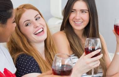 Group of young adults drinking wine
