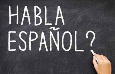 Habla Espanol written on chalkboard