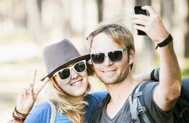 Two people in boomerang generation taking a selfie