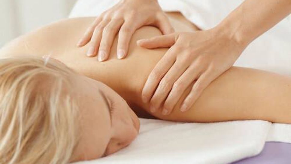 Young woman having massage, close-up