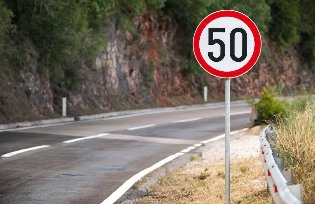 Round speed limit road sign