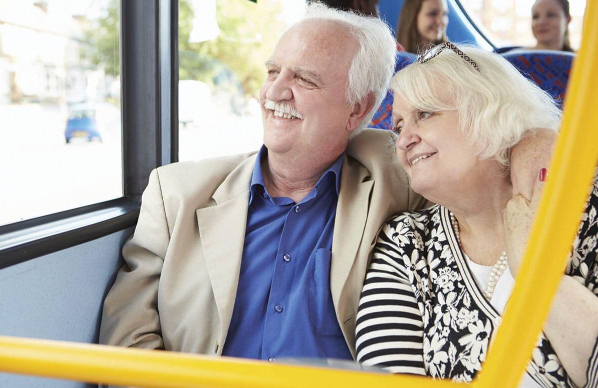 Retired couple riding public transportation