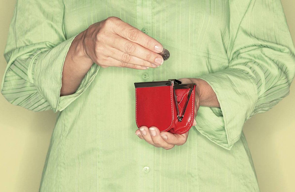 Woman putting change in her purse