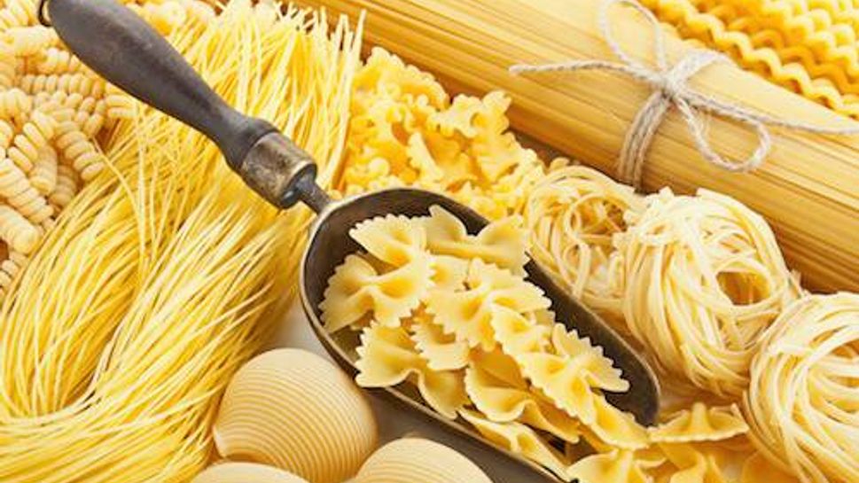 retro still life with assortment of uncooked pasta