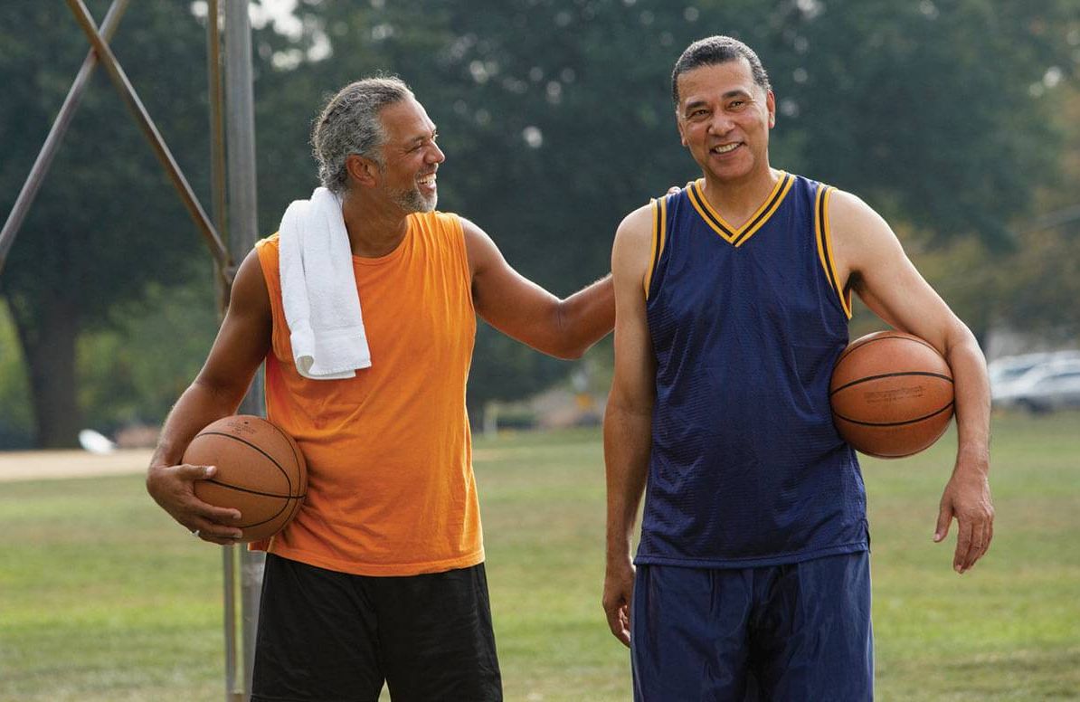Two older men after playing basketball