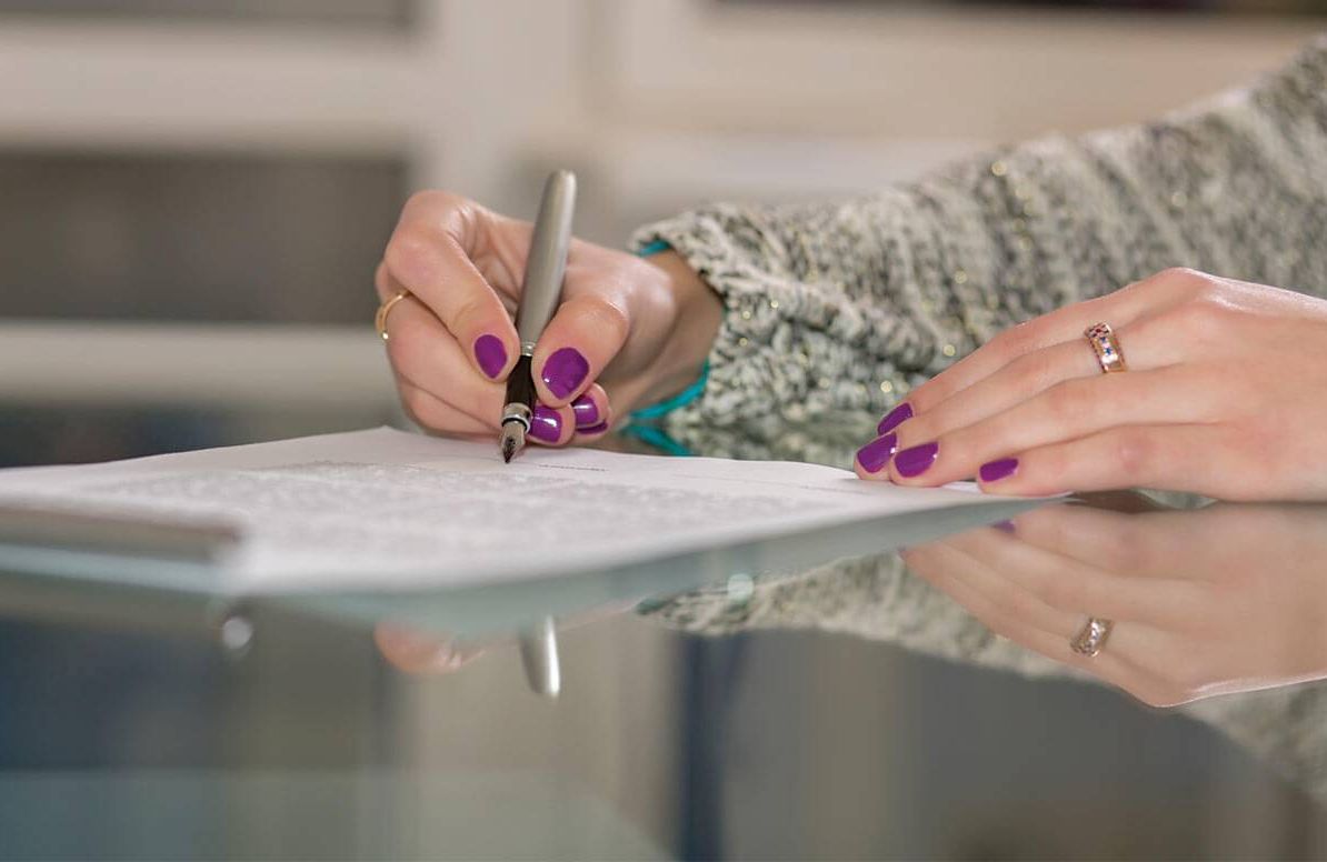 Woman writing letter of instruction for personal property