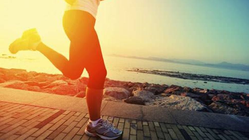 A man running in the morning sunlight