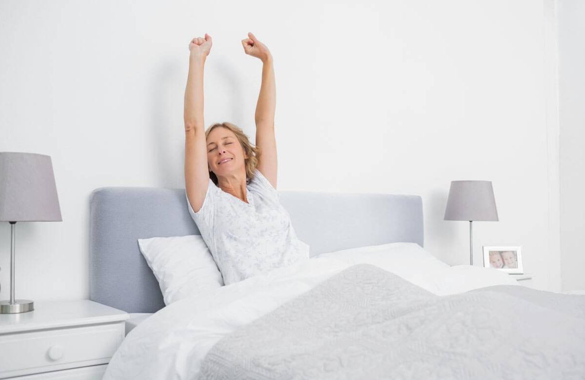 Woman stretching her arms in the morning