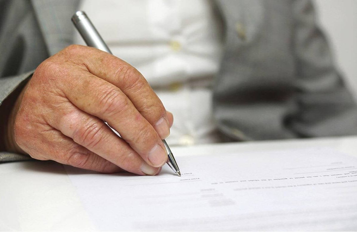 Man signing a document