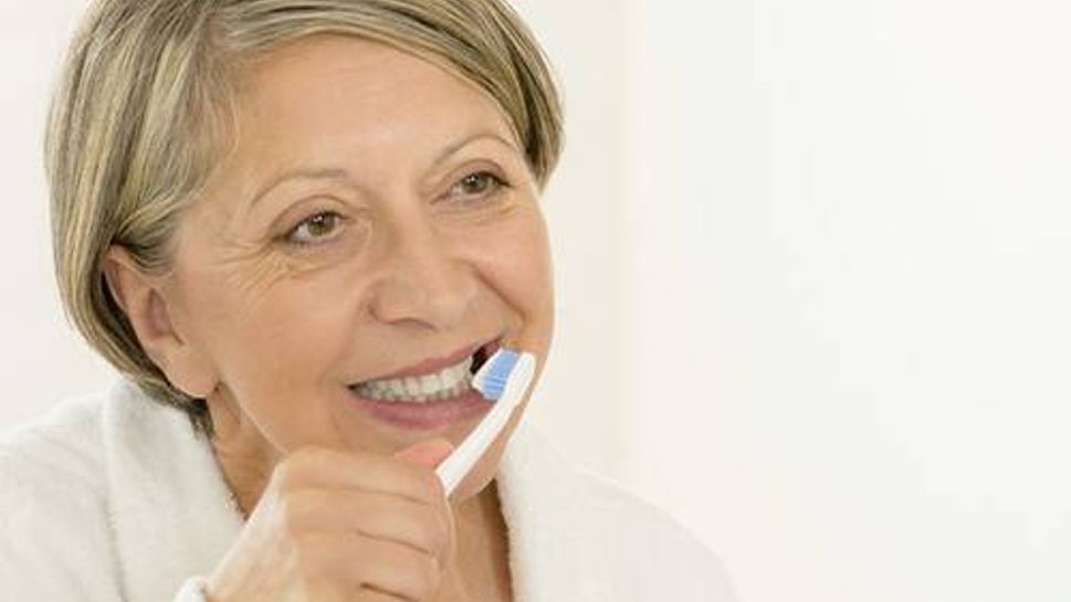 Woman brushing teeth