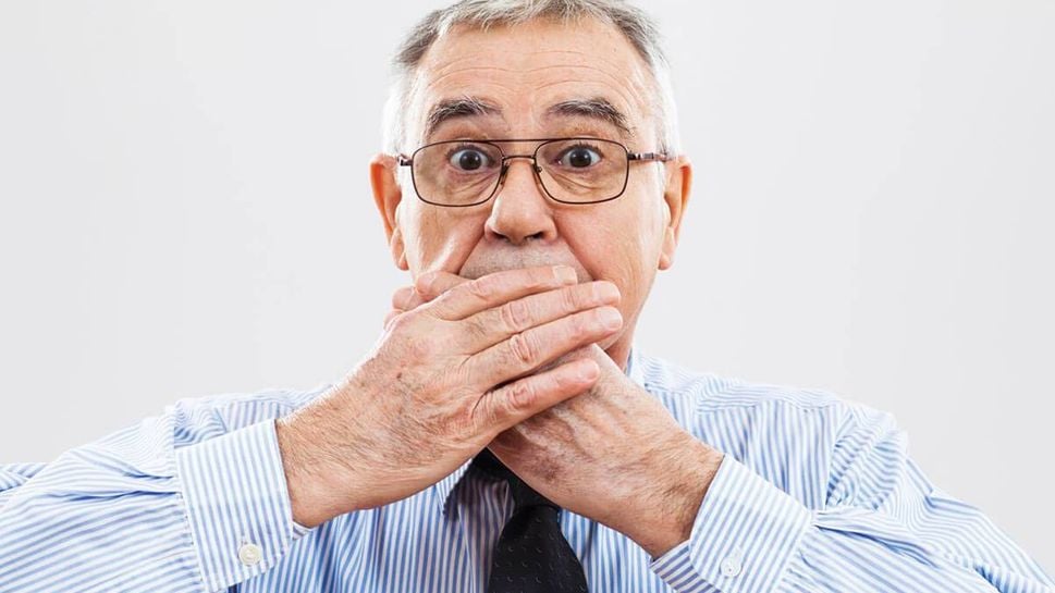 Man hiding his teeth