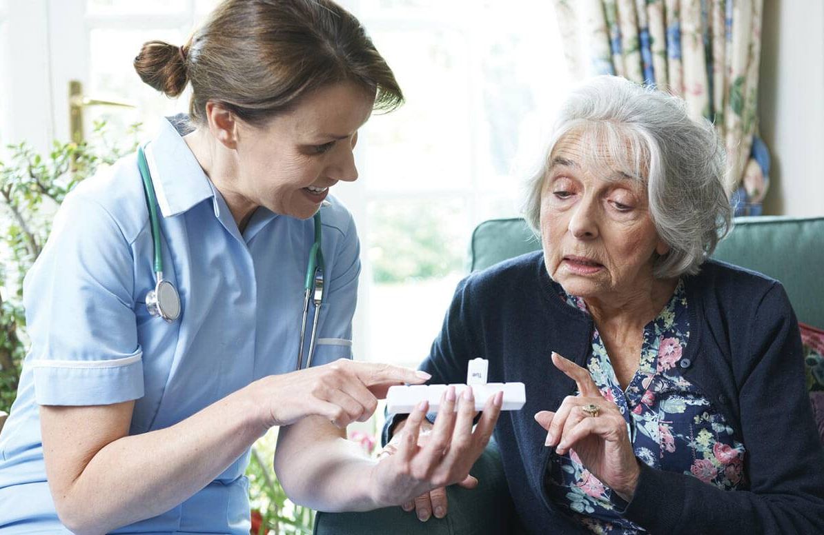 Woman talking with health aide