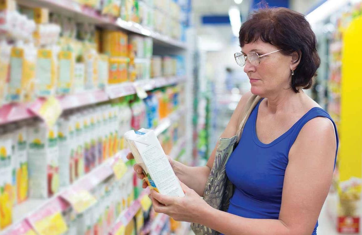 Woman reading food label
