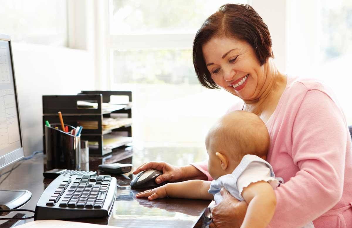 Woman at work with grandchild