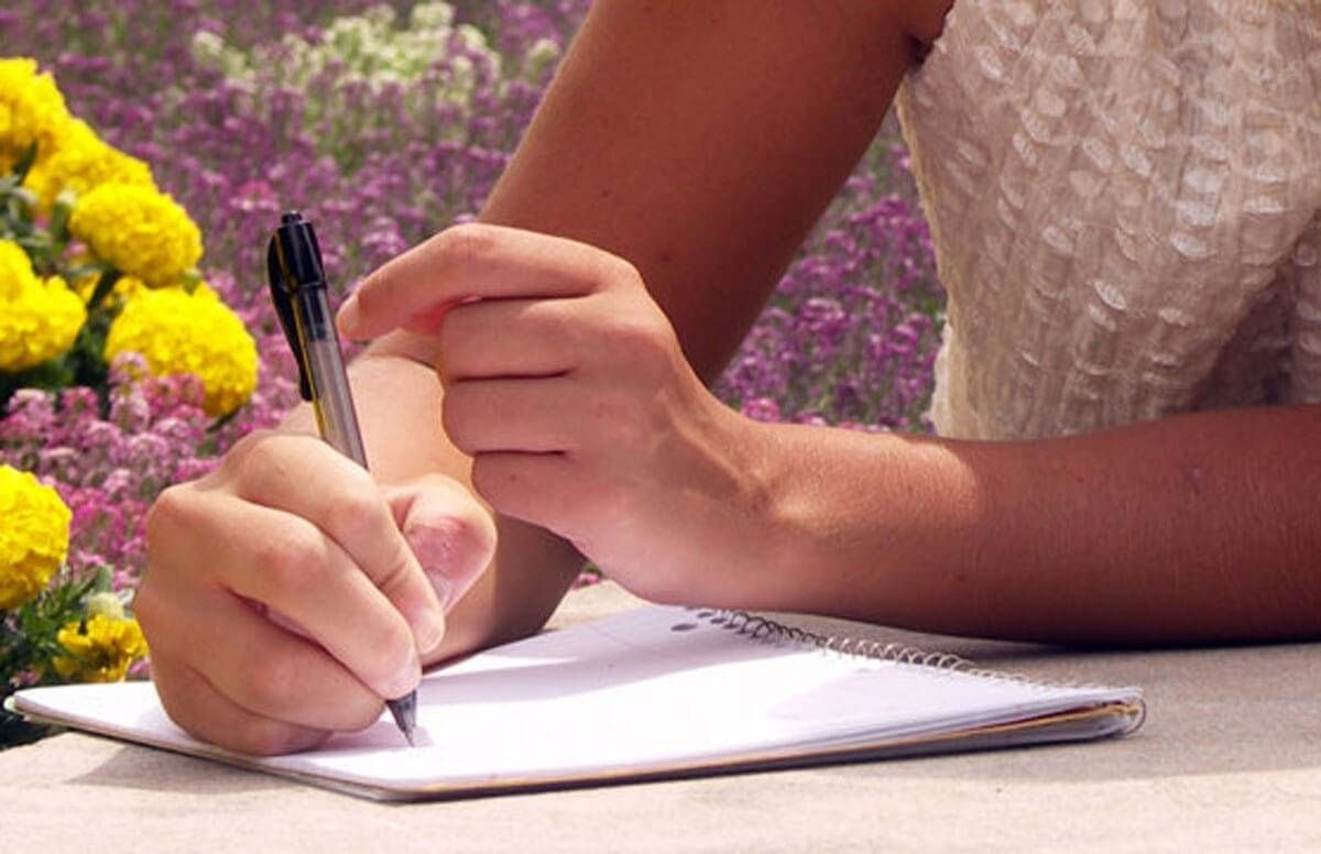 young woman writing letter