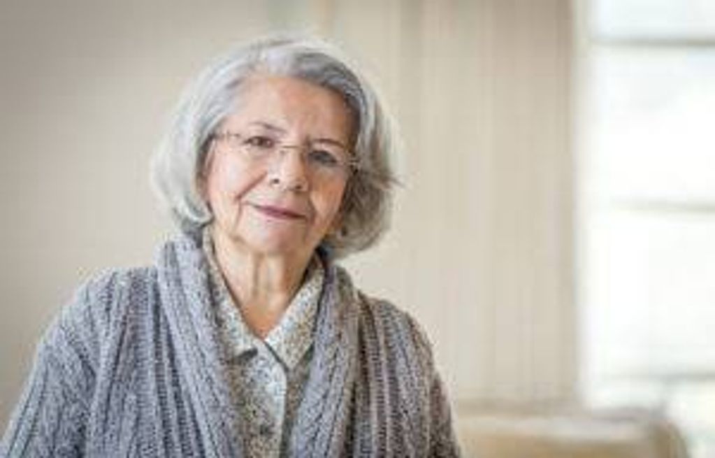 Close up of serious face of older Hispanic woman