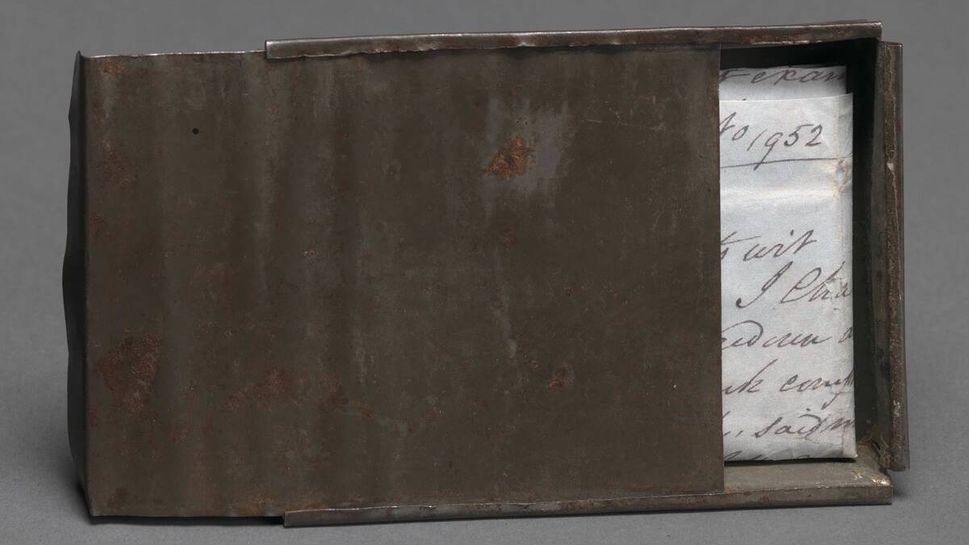 Freedom papers and handmade tin carrying box belonging to Joseph Trammell (1852)
