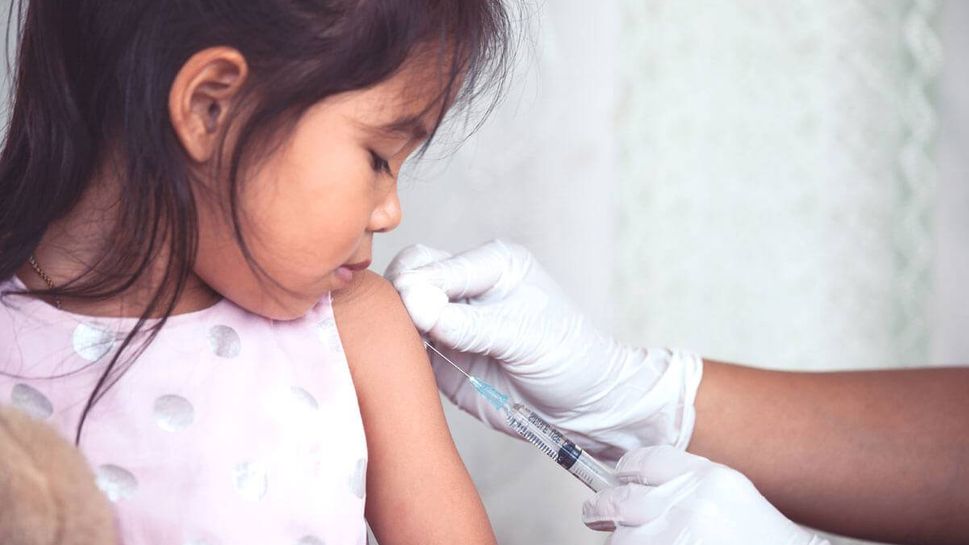 Little girl gets a shot at the doctor's office