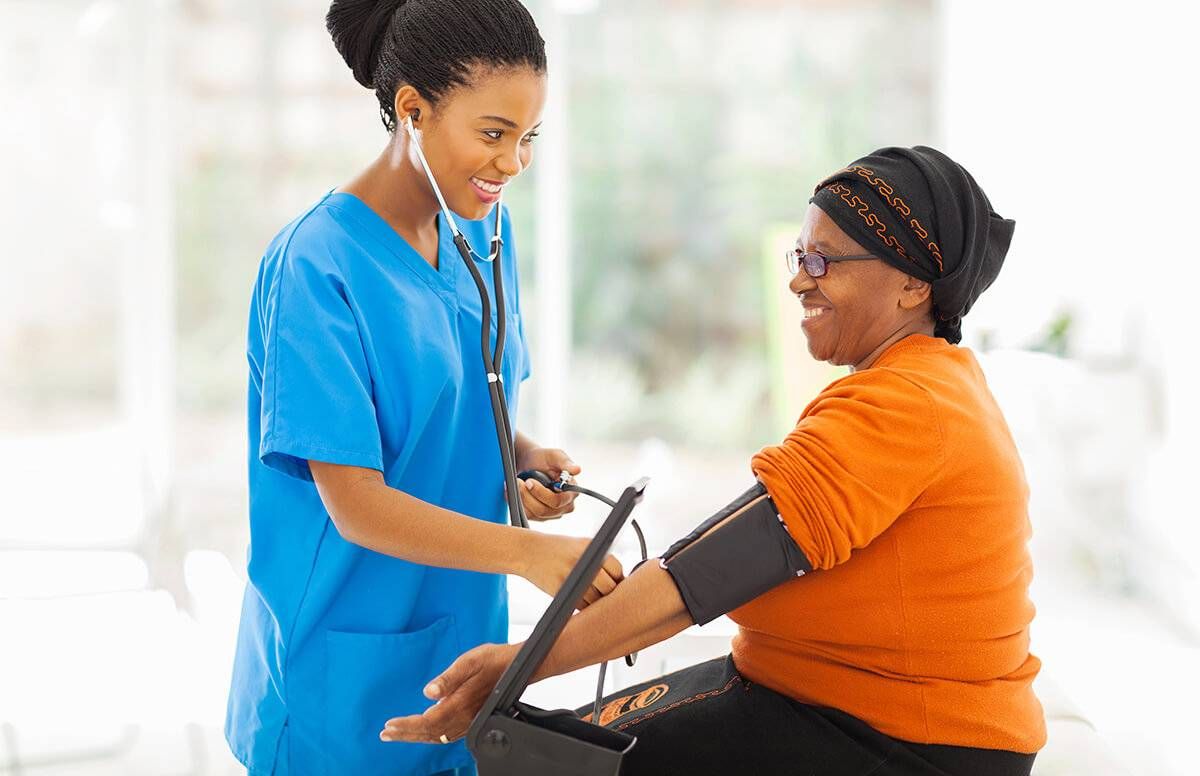 a nurse takes a patient's blood pressure
