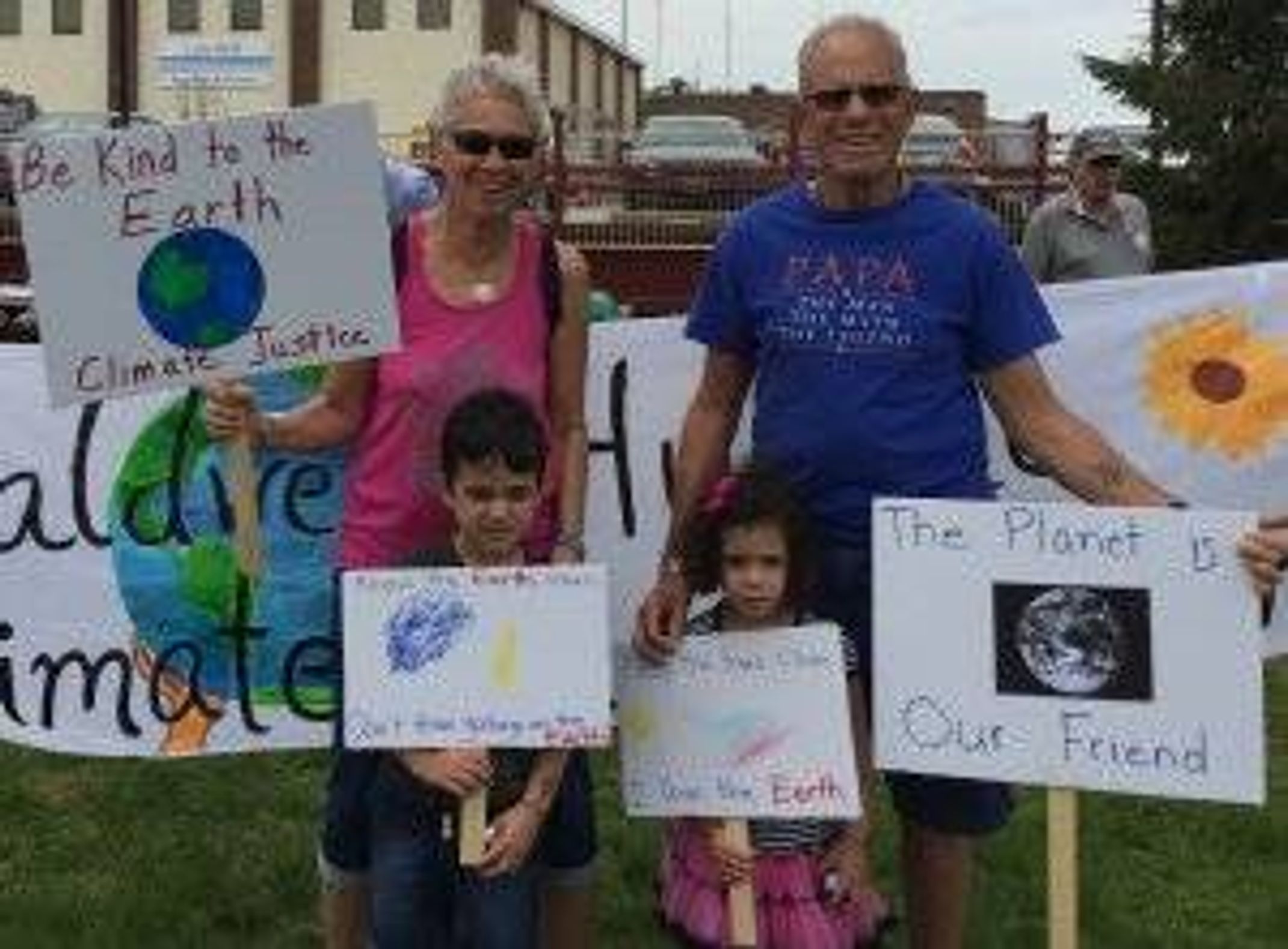 Barry and Claire Nelson at a march with their grandkids