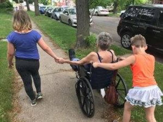Two of Sareen Dunleavy Keenan’s children hang out with her mom, who is immobile as she recovers from one of about 20 surgeries she’s had since the late 1990s. Photo courtesy of Sareen Dunleavy Keenan.