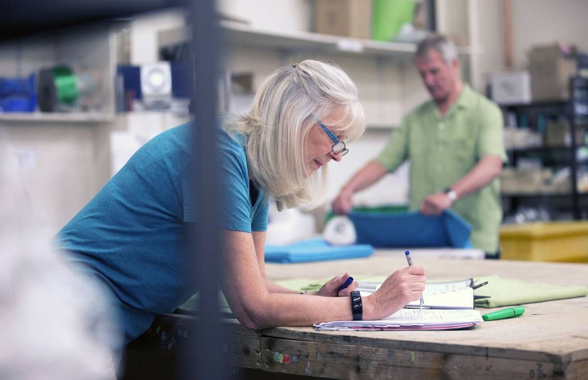 Businesswoman Doing Stock Paperwork