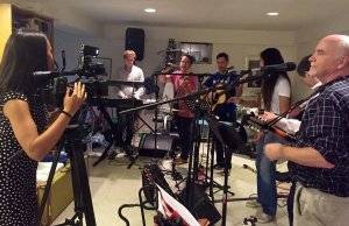 Crys Young, Dr. John O'Shea, and other NIH scientists gather at Dr. Shea's house to jam.