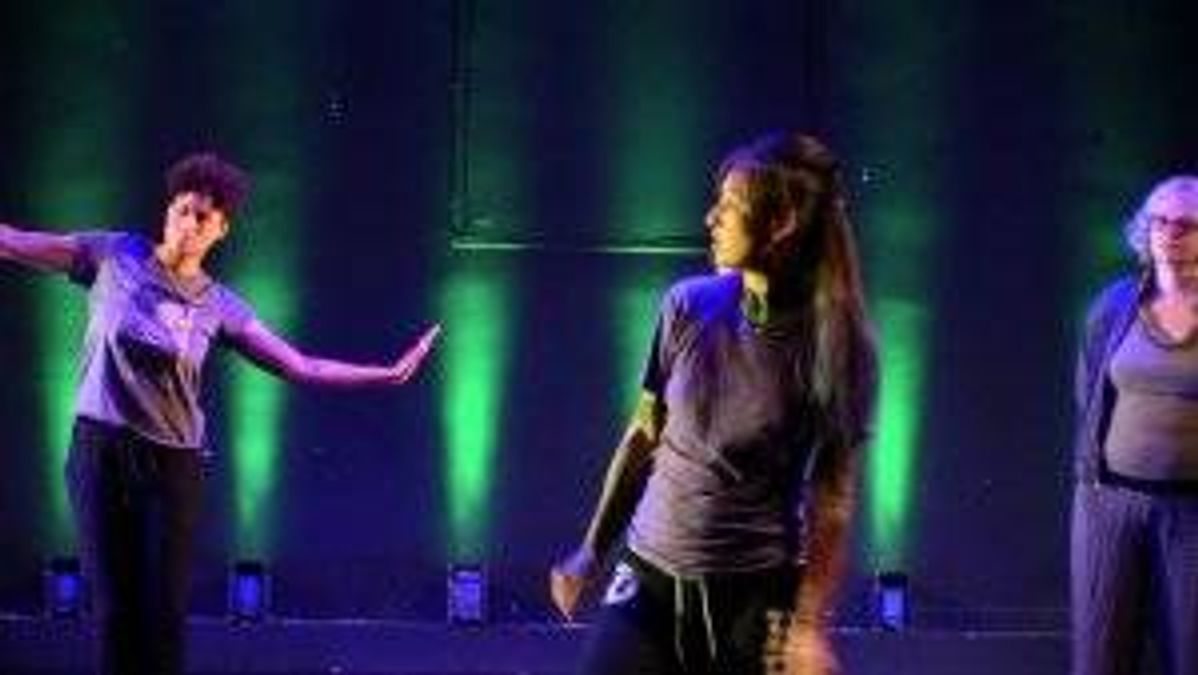 Invited artist Shanna Lim (center) leads participants in an interpretative dance performance during the March 9 Washington, D.C., production of Quicksilver’s “Imaginary Gardens.”