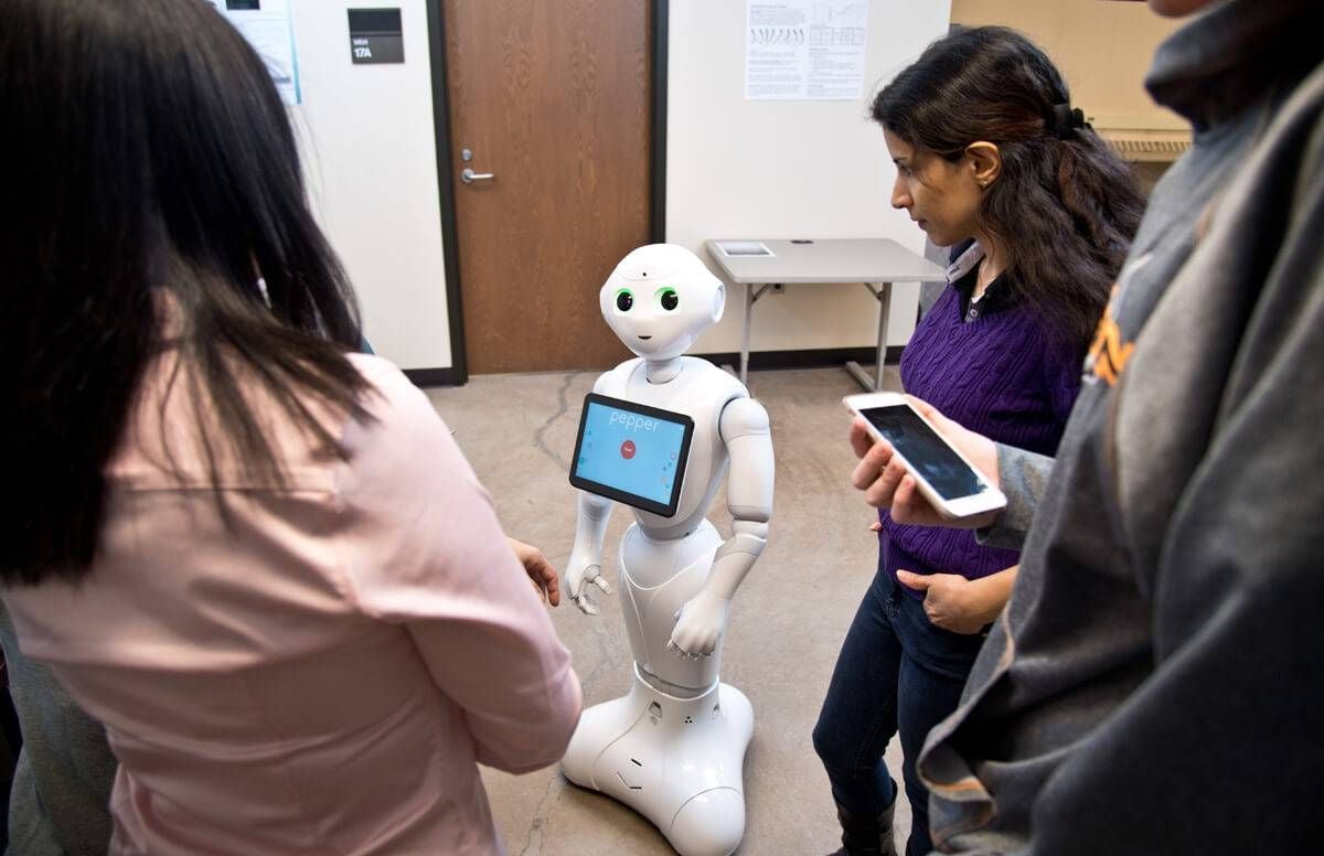 The robot shop worker controlled by a faraway human