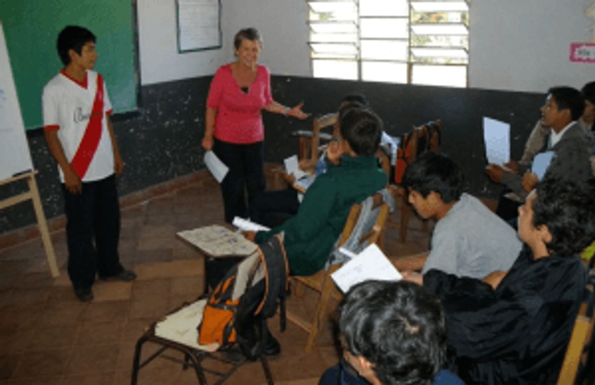 Middle-school student in Paraguay getting tips on public speaking