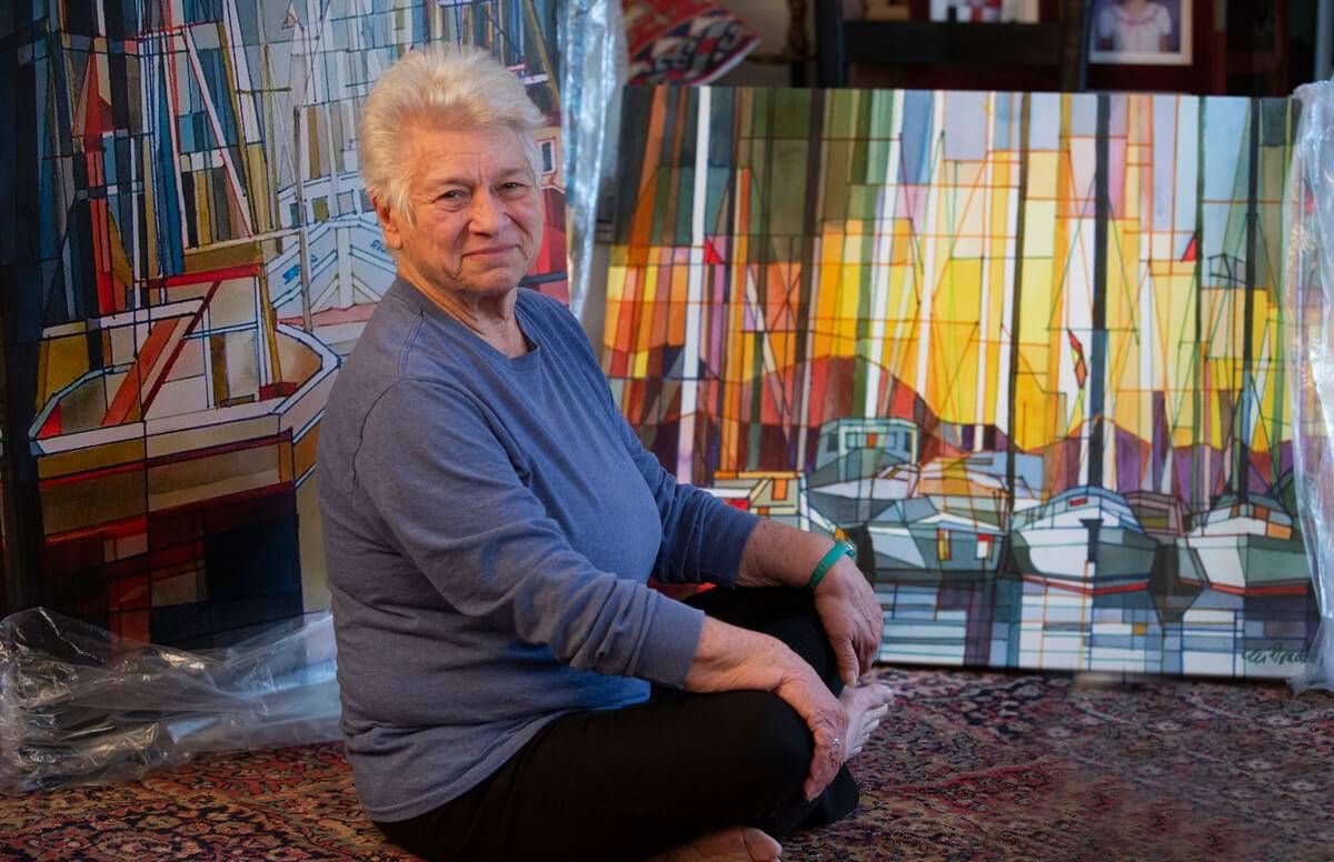 Artist Marilynne Bradley at home in Webster Groves, surrounded by her artwork, including some of her latest work, geometric watercolors on canvas which are being readied for a show at the St. Louis Artist Guild.