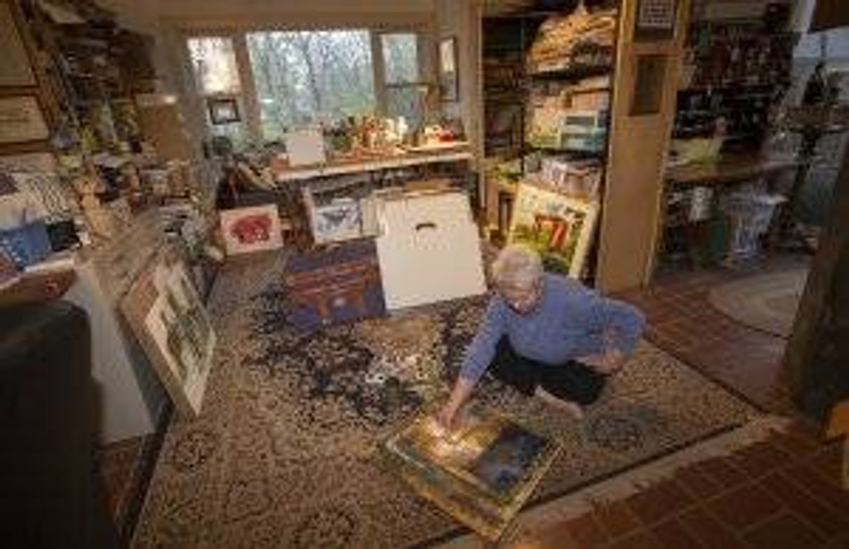 Artist Marilynne Bradley at home in Webster Groves, surrounded by her artwork. She likes working seated on the floor and is currently creating work that has a geometric pattern. KAREN ELSHOUT/photo