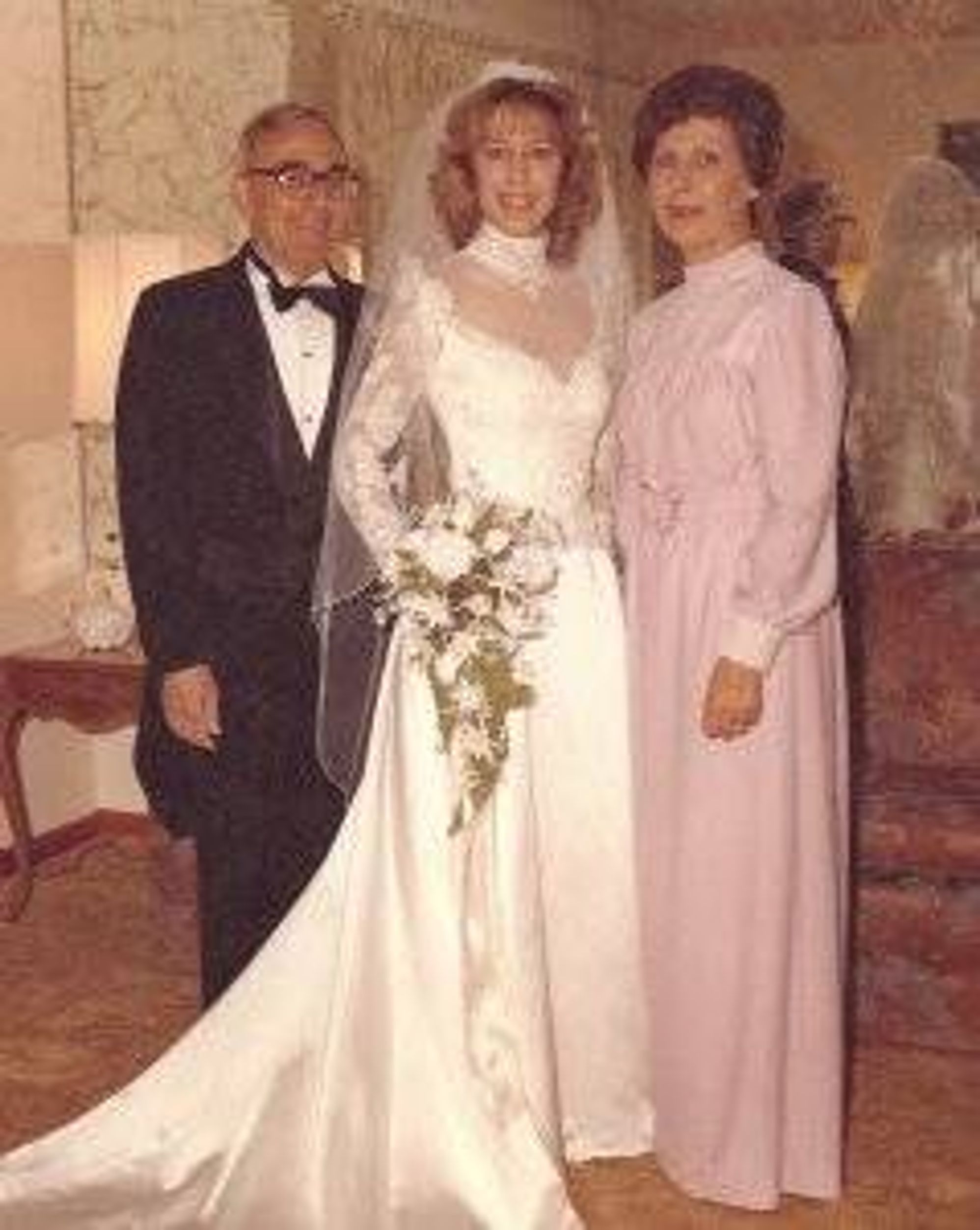 Patricia and her parents on her wedding day