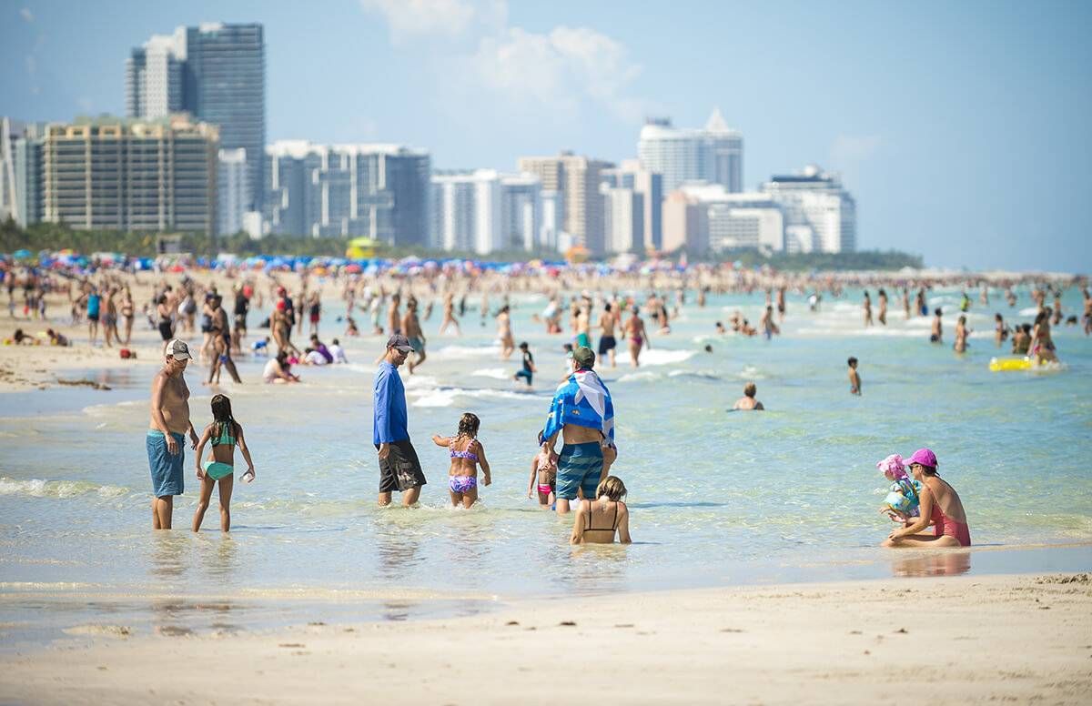 beach with people swimming