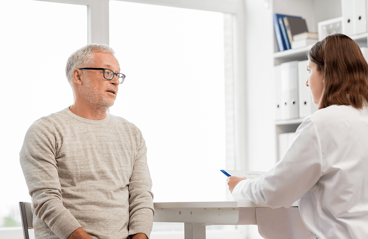 middle aged man consulting with his doctor