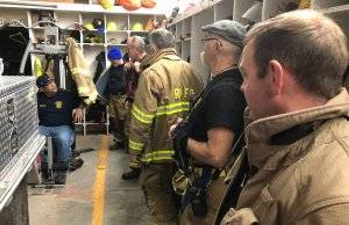 Members of the Rensselaerville (N.Y.) Volunteer Fire Department are briefed before a practice exercise. At 40, Kevin Brew (foreground), is one of the “youngsters” in the department.