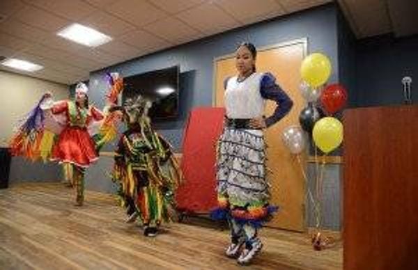 Youth from the community perform a dance at the grand opening of Mino Oski Ain Dah Yung, an affordable housing development serving homeless American Indian youth on Wednesday, Nov. 20 in St. Paul, Minn.