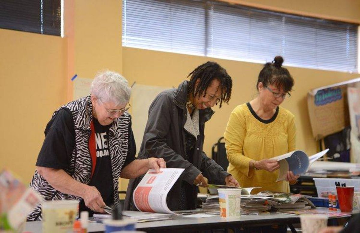 Students peruse magazines for visual inspiration. (From left to right) Judy Baldwin, Beverly J. Davis and Kyoko Katayama