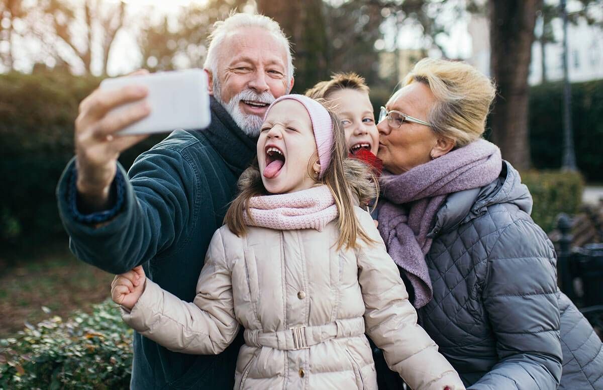 grandparents and grandkids taking a selfie