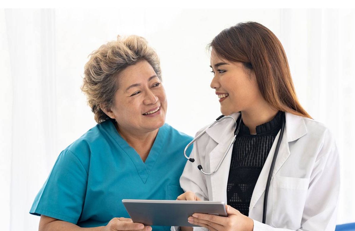 Doctor cheerfully consulting with patient