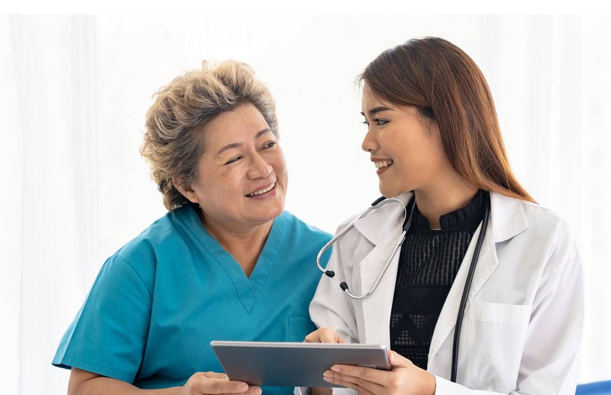 Doctor cheerfully consulting with patient