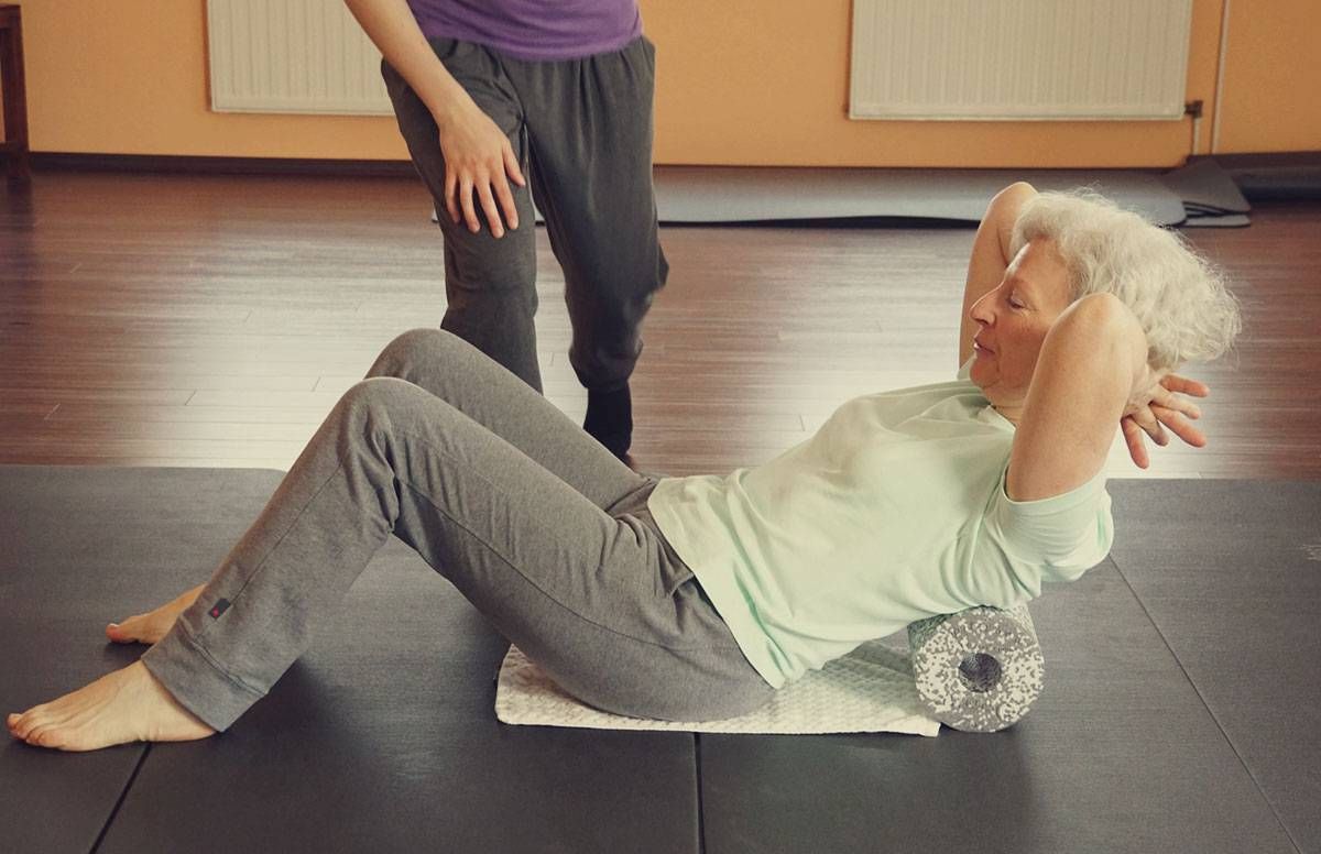 middle-aged woman enjoying pilates