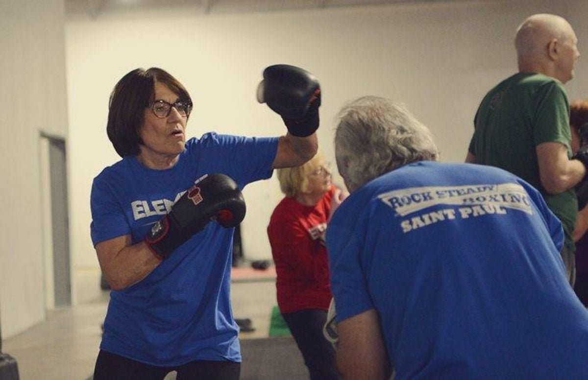 Sheila Proehl partnered up with fellow boxing student Jim Hunt for the punching sequences exercise.