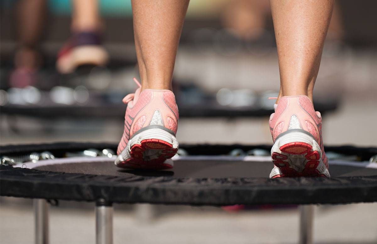 Pink sneakers on a mini-trampoline