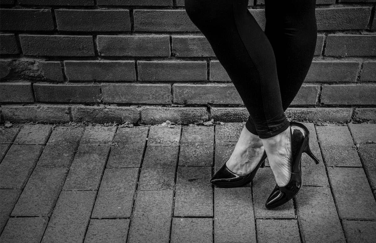 Woman's high heels on the pavement