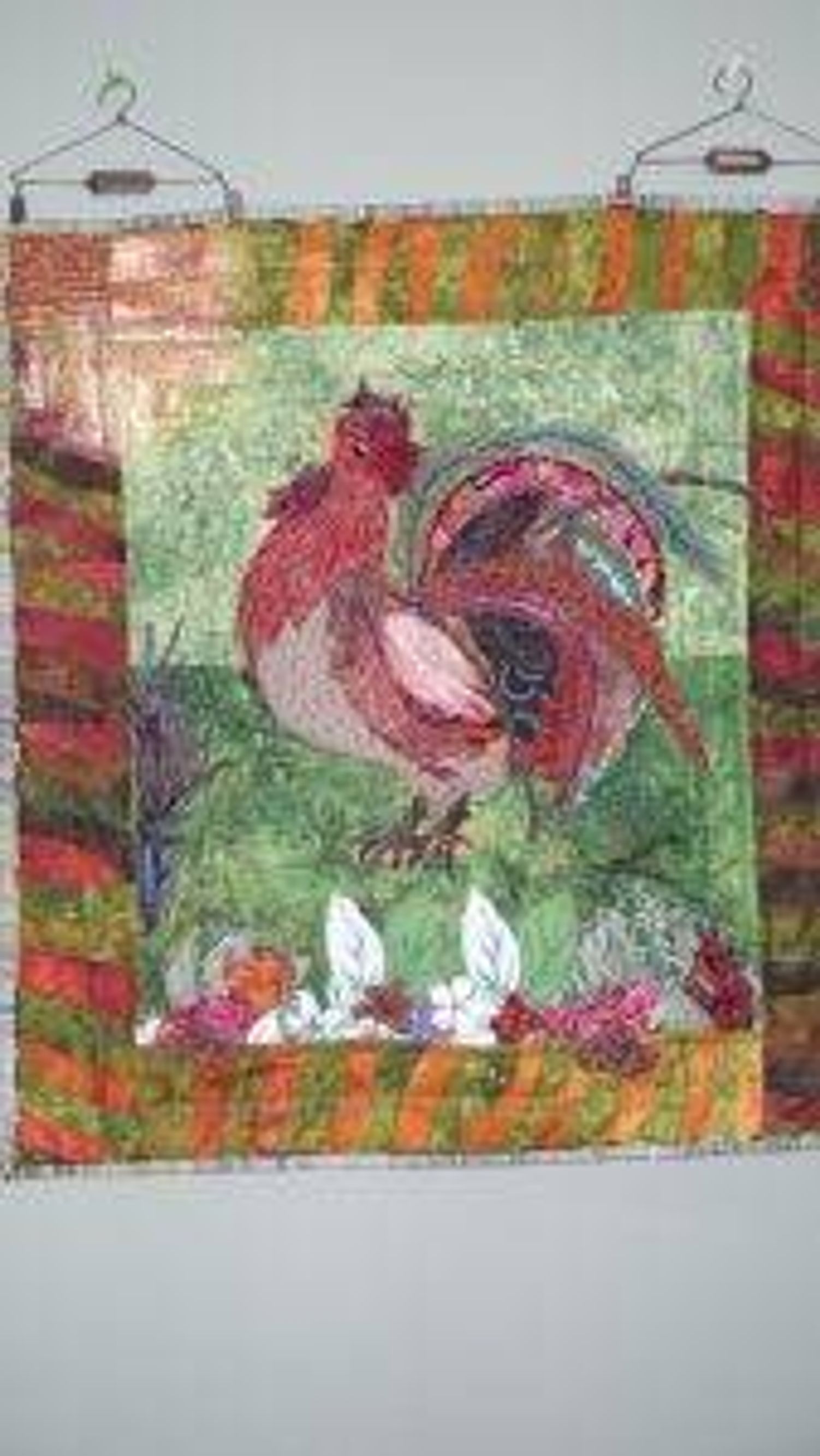 A handmade quilt featuring a Hawaiian rooster by DeAnne Mack.