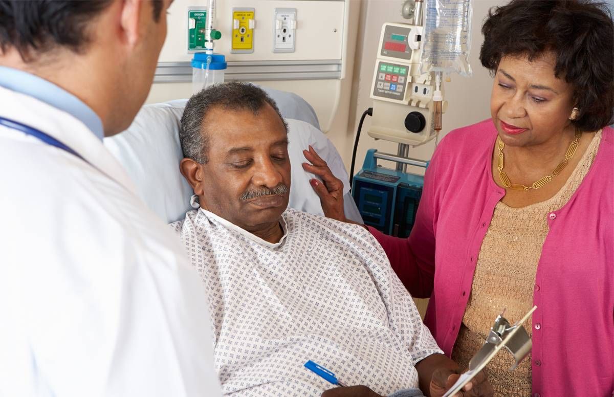 hospital patient signing a form