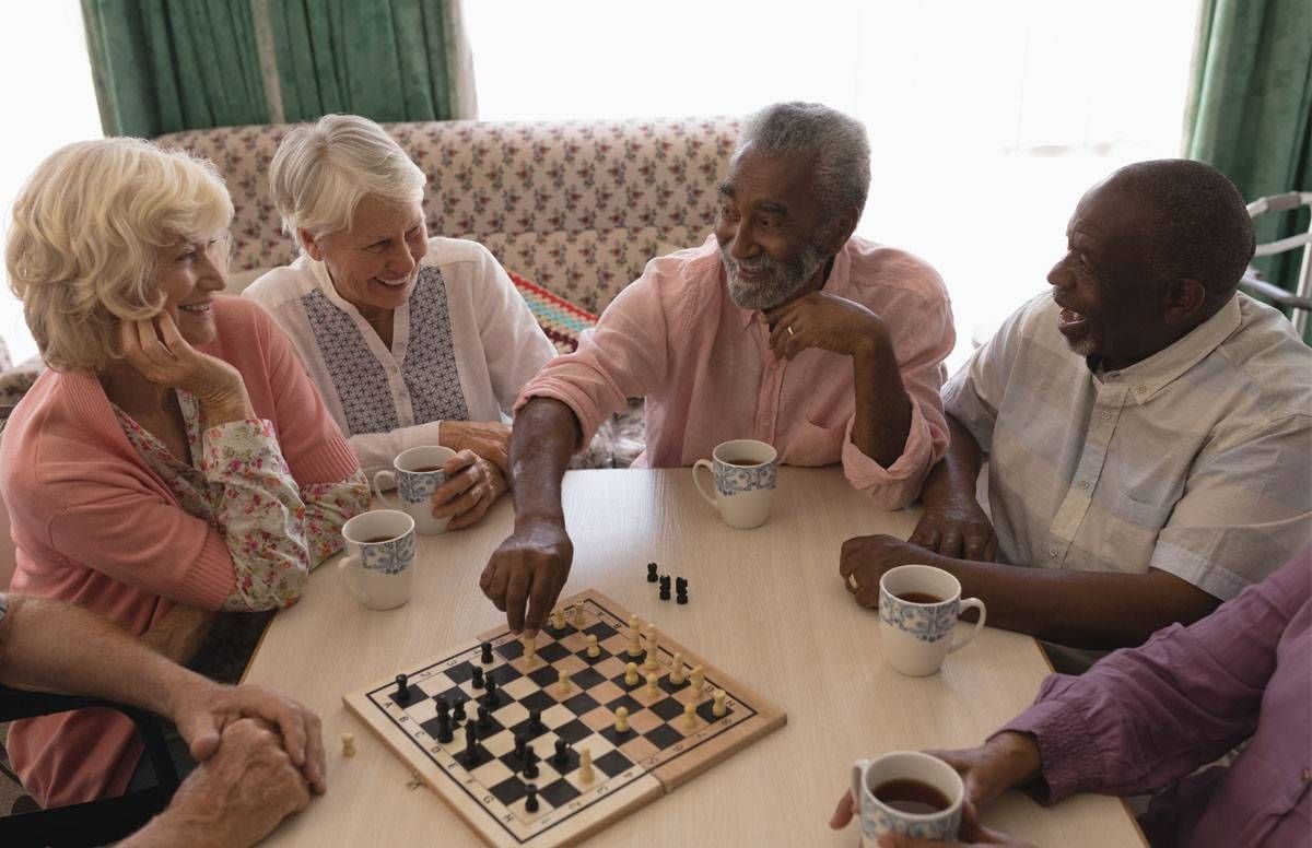 Seniors playing chess at their day program.