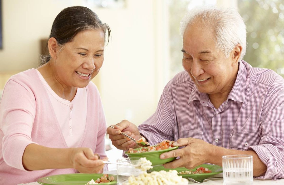 older couple eating at home