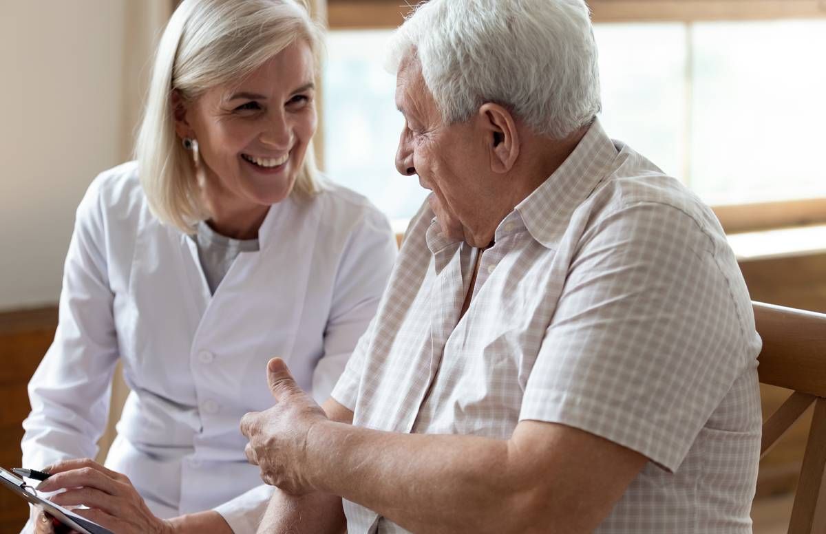 older man and health aide